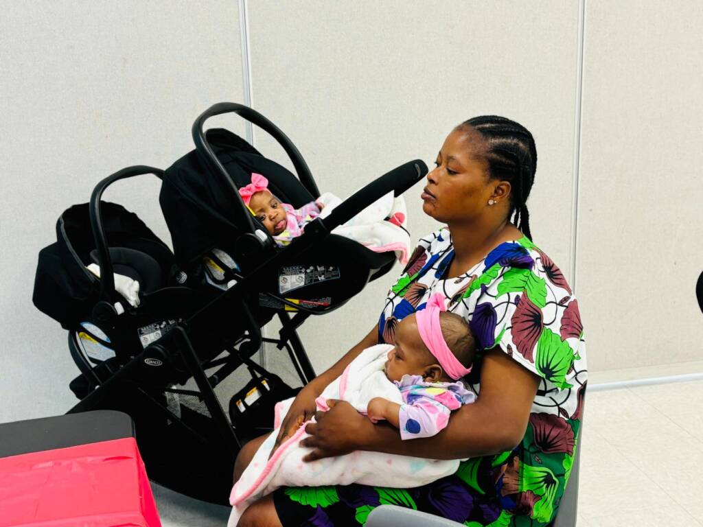 CACCTA Ontario Children's church pastor overseeing and carrying a baby at hand